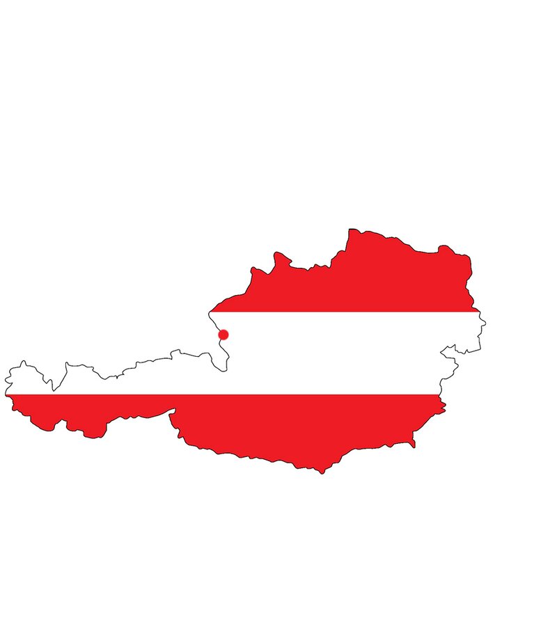 Umriss von Österreich auf rot weiß roten Hintergrund, Lage Bergheims eingezeichnet mit rotem Punkt